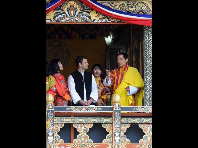 Former King of Bhutan Jigme Sinagye Wangchuk talks with Rahul Gandhi during a ceremony for the newly wed Bhutanese royal couple at the main stadium in Thimphu.