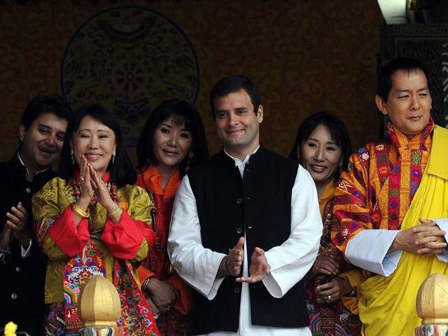 Former Bhutan King Jigme Sinagye Wangchuk with his queens, Rahul Gandhi and Jyotiraditya Madhavrao Scindia applaud the crowd during a ceremony at the main stadium in Thimphu.