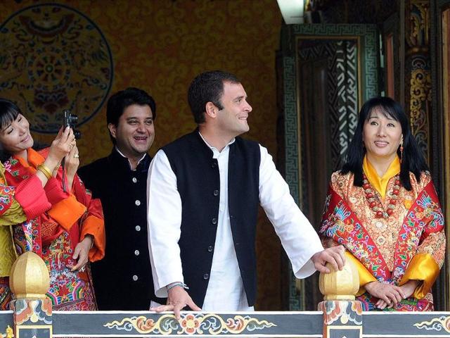 MP Rahul Gandhi and Jyotiraditya Madhavrao Scindia react as queens of former Bhutan King Jigme Sinagye Wangchuk take photographs during a ceremony for the newly wed Bhutanese couple at the main stadium in Thimphu in Bhutan.