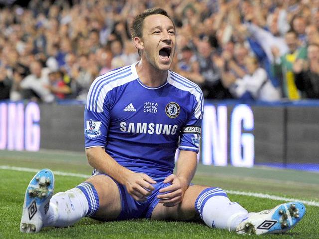Chelsea's John Terry celebrates after scoring against Everton during their English Premier League soccer match at the Stamford Bridge Stadium, London. (Photo: AP)