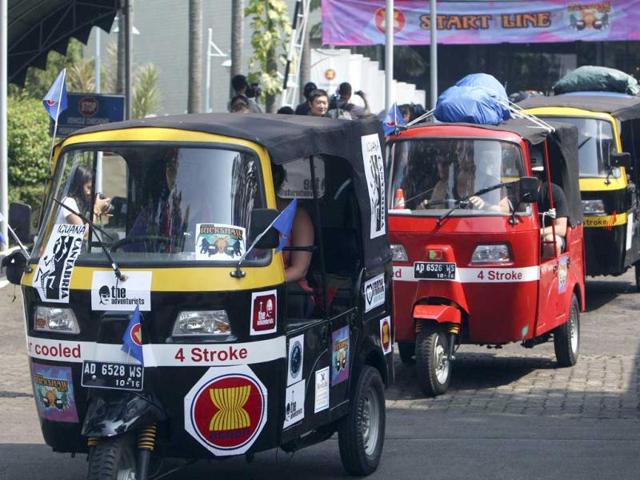 Participants drive rickshaws at the start of the ASEAN Rickshaw Run in Jakarta, Indonesia.