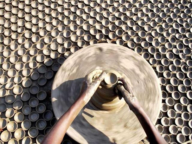 A potter busy in making earthen lamps ahead of Diwali festival in Allahabad.