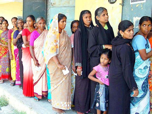 Women lining up in front of a polling station to cast their votes for local body elections, in Chennai.