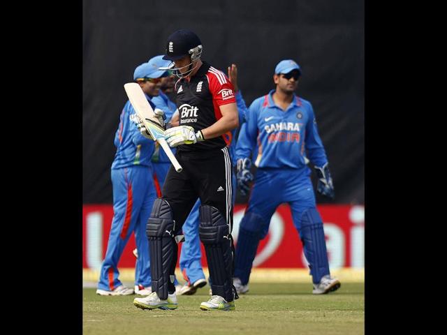 Craig Kieswetter walks back to the pavilion after being dismissed by Vinay Kumar during their second one-day international cricket match in New Delhi.