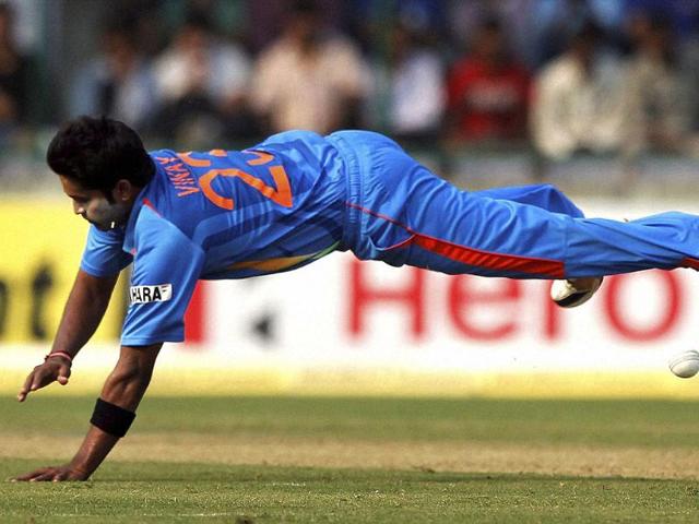 Vinay Kumar dives to stop the ball during the 2nd ODI cricket match against England in New Delhi.