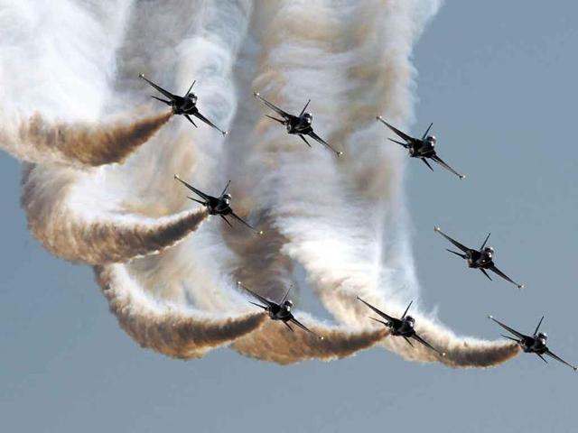 The Black Eagles, an aerobatic team of T-50 jets belonging to South Korea's Air Force, fly in formation during the opening of the Seoul International Aerospace and Defense Exhibition 2011 at the Seoul Military Airport in Seongnam, south of Seoul.