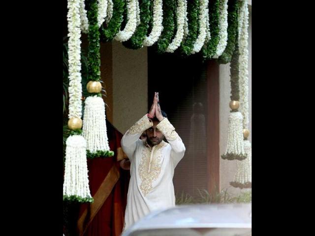 The Bandra house was decorated with flowers, and was packed with people in the afternoon. (HT photo/Vijayanand Gupta)