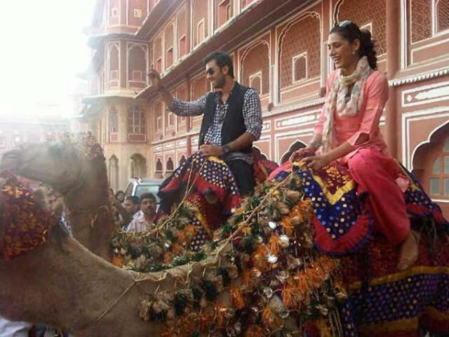 Ranbir and Nargis taking camel ride together.