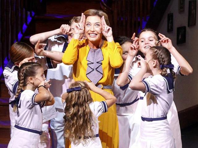 Actress Wietske van Tongeren (C), acting as Maria Rainer, performs on stage with children during a dress rehearsal for the Austrian musical The Sound of Music in Salzburg. (Reuters)