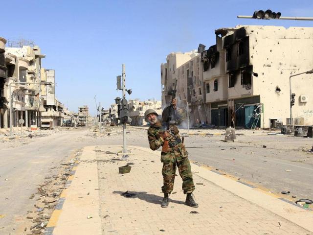 An anti-Gaddafi fighter celebrates the fall of Sirte.(Reuters/Esam Al-Fetori)