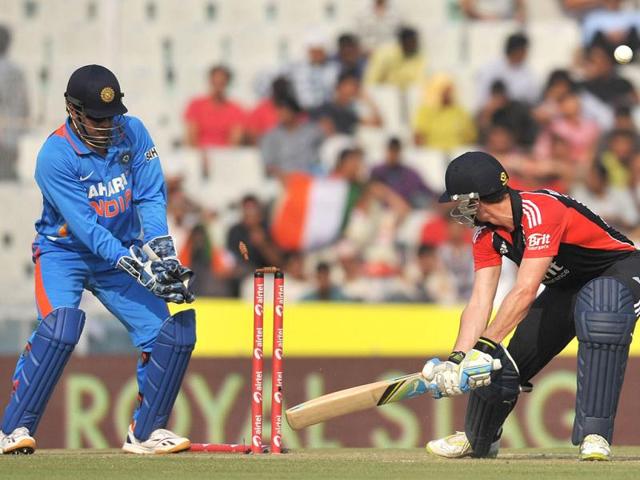 England cricketer Craig Kieswetter is bowled by Indian bowler Virat Kohli during the third One day International in Mohali.