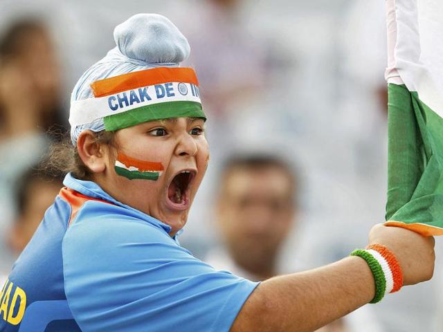 An India fan reacts during the third one-day international cricket match between India and England in Mohali.