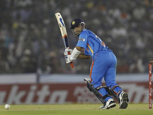 Ajinkya Rahane bats during India's third one-day international cricket match against England in Mohali.