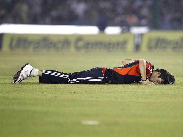England's Steven Finn reacts after a misfield during their third one-day international cricket match against India in Mohali.