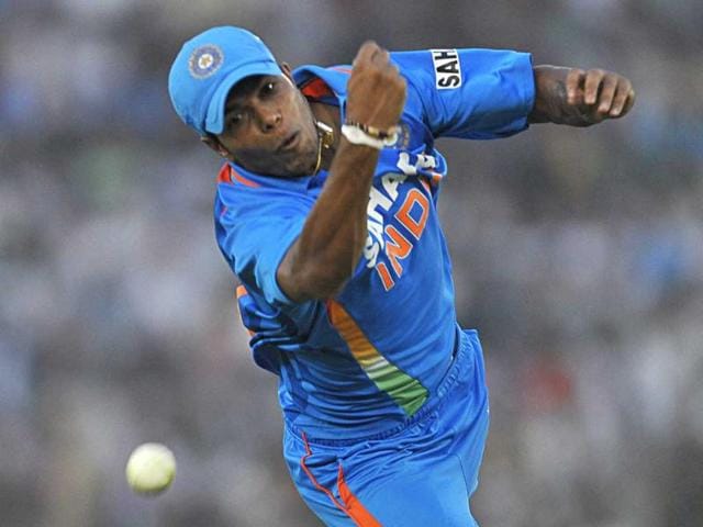Bowler Umesh Yadav dives in an attempt to take a catch during the third ODI match against England in Mohali.