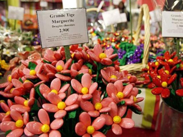 Flower-shaped chocolates are displayed at a stand as part of the 17th Salon du Chocolat (chocolate fair) in Paris. (AFP)