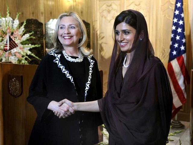 US secretary of state Hillary Clinton (L) shakes hands with Pakistan's foreign minister Hina Rabbani Khar after a joint press conference in Islamabad. (AFP)