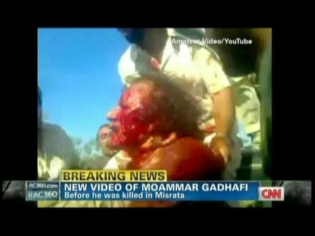 In this TV grab from YouTube courtesy CNN, Muammar Gaddafi is seen covered in blood moments after he was captured by Libyan rebel forces in his hometown Sirte. (AFP)