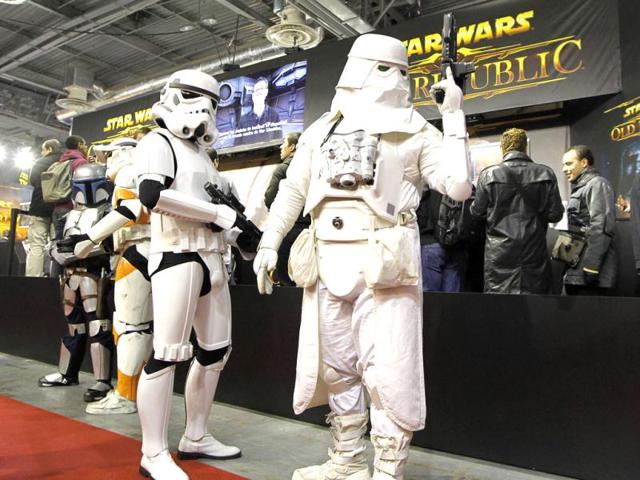 People dressed as characters from Star Wars are seen during the Paris Games Week show in Paris.