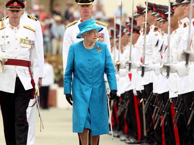 Queen Elizabeth II inspects cadets during the presentation of the colors at the Royal Military College, Duntroon, in Canberra, Australia. (AP Photo)