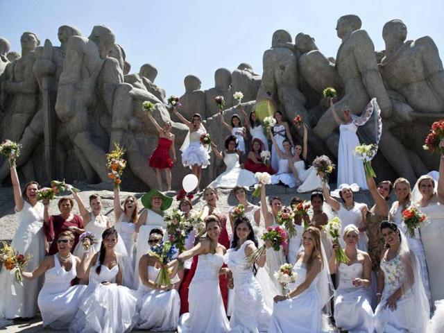 Women wearing bridal dresses take part in a bride parade, in Sao Paulo, Brazil. Around 40 brides took part in the event organized to promote family tradition, marriage and maternity.