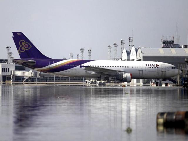 A Thai Airways' aircraft is parked at the flooded maintenance center in Don Mueang airport in Bangkok, Thailand. (AP)