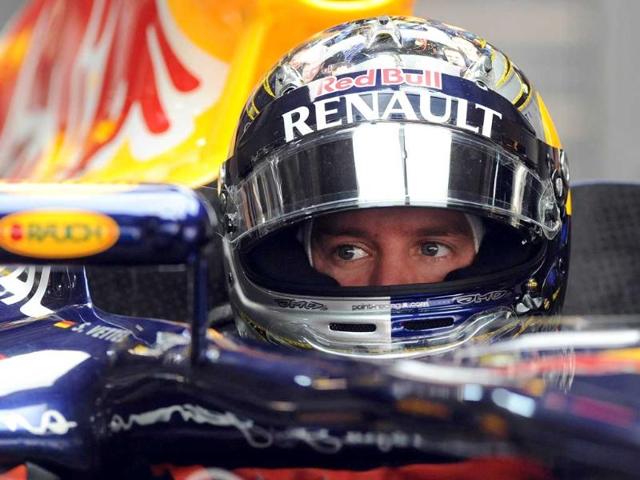 Red Bull-Renault driver Sebastian Vettel of Germany gets ready during the first practice session of Formula One's Indian Grand Prix at the Buddh International circuit in Greater Noida.