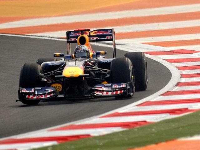 Red Bull-Renault driver Sebastian Vettel of Germany powers his car during the first practice session of the Formula One Indian Grand Prix in Greater Noida.