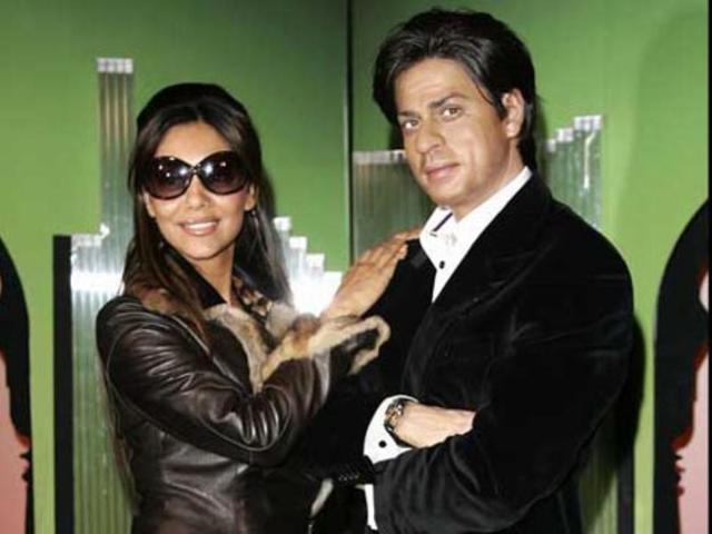 SRK's wife Gauri Khan poses with his wax replica.