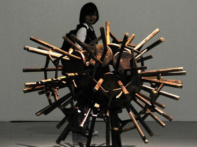 A woman looks at an art work entitled "Grapes" by Chinese dissident artist Ai Weiwei at the Taipei Fine Art Museum.