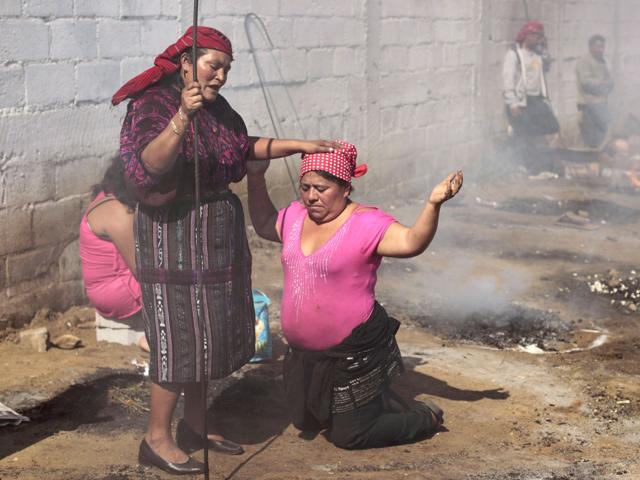 A woman conducts a ritual outside the church of San Simon in Iztapa, in the region of Escuintla, 62 km (39 miles) from Guatemala City. People in Guatemala revere San Simon, also known by its Mayan name Maximon o Ry Laj Man, on October 28 annually. For some devotees, San Simon is synonymous with prosperity and happiness, while others associate him with witchcraft, paganism and a protector for drunkards.