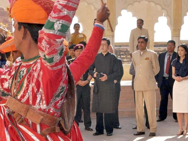 Bhutan's King Jigme Khesar Namgyel Wangchuk and his wife Queen Jetsun Pema enjoy folk dance at Mehrangarh fort in Jodhpur.