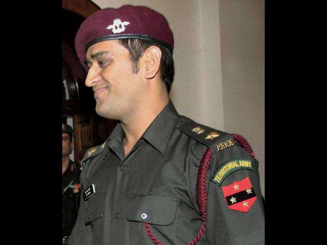 Cricket captain Mahendra Singh Dhoni after the pipping ceremony following grant of honorary ranks in the Territorial Army. (PTI Photo)
