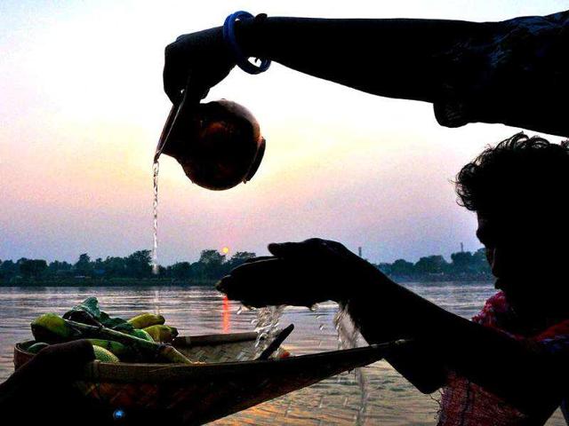 Devotees whorship the Sun God during Chhath festival in Murshidabad