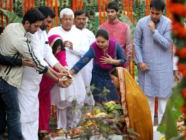 RJD chief Lalu Prasad Yadav, his wife Rabri Devi and LJP President Ramvilas Paswan, with his family, performing Chhath puja at Lalu's residence in New Delhi.