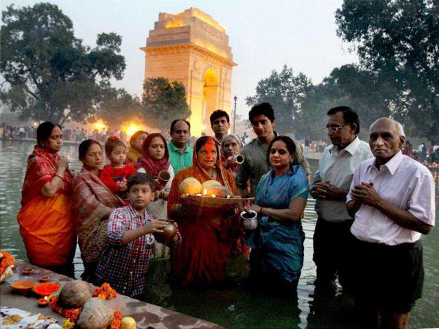 People observe the festival of Chhath Puja near India Gate in New Delh.
