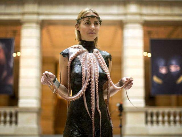A model wears a creation made of seaweed and octopus by chef and food designer from South Tyrol Roland Trettl at the communications museum (Museum fuer Kommunikation) in Berlin.