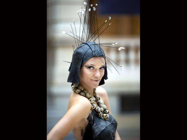 A model wears a creation made of pasta and quail eggs by chef and food designer from South Tyrol Roland Trettl at the communications museum (Museum fuer Kommunikation) in Berlin.