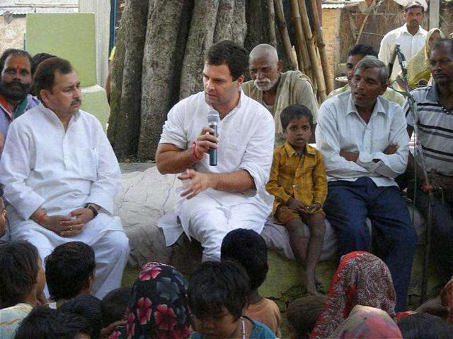 Congress general secretary Rahul Gandhi holding a chaupal under a tree at a village in Bhadohi district.