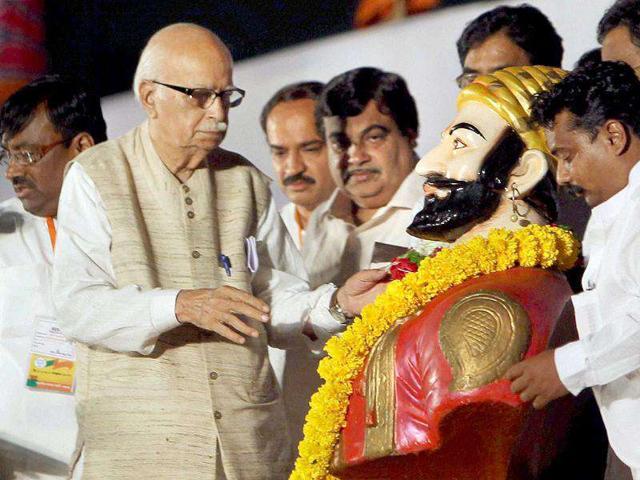 Senior BJP senior leader L K Advani garlands a statue of Chhatrapati Shivaji at a public meeting during his Jan Chetna Yatra in Pune in Maharashtra.