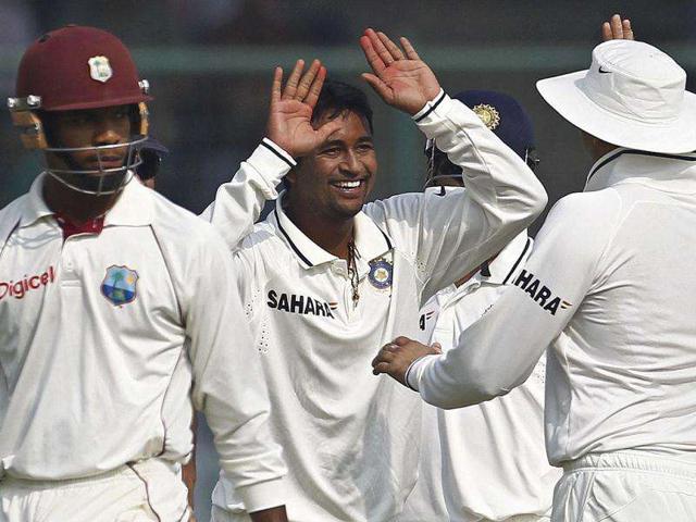 Pragyan-Ojha-C-celebrates-with-his-team-mates-after-dismissing-West-Indies-Kieran-Powell-L-during-the-first-day-of-their-first-Test-cricket-match-in-New-Delhi Pragyan-Ojha-C-celebrates-with-his-team-mates-after-dismissing-West-Indies-Kieran-Powell-L-during-the-first-day-of-their-first-Test-cricket-match-in-New-Delhi