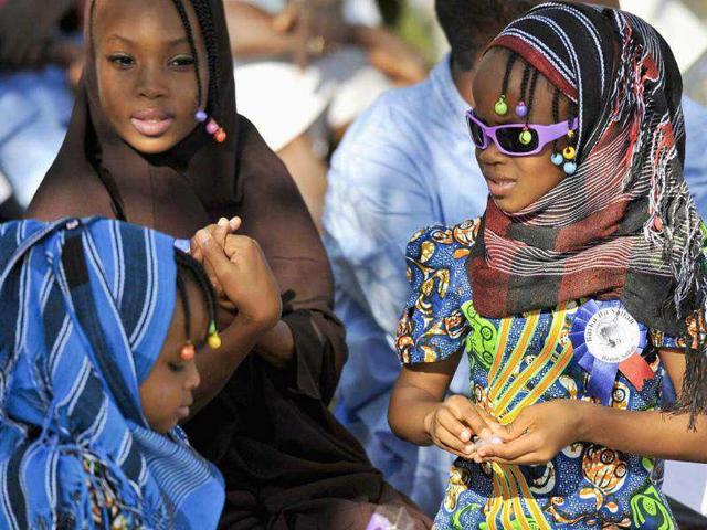 Girls attend prayers marking the Muslim festival of Eid al-Adha in the capital Abuja. Muslims around the world celebrate Eid al-Adha to mark the end of the haj pilgrimage by slaughtering sheep, goats, camels and cows to commemorate Prophet Abraham's willingness to sacrifice his son, Ismail, on God's command.