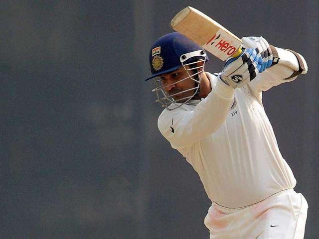 VVS-Laxman-plays-a-shot-on-the-fourth-day-of-the-first-of-the-three-cricket-test-match-series-between-India-and-West-Indies-in-New-Delhi VVS-Laxman-plays-a-shot-on-the-fourth-day-of-the-first-of-the-three-cricket-test-match-series-between-India-and-West-Indies-in-New-Delhi