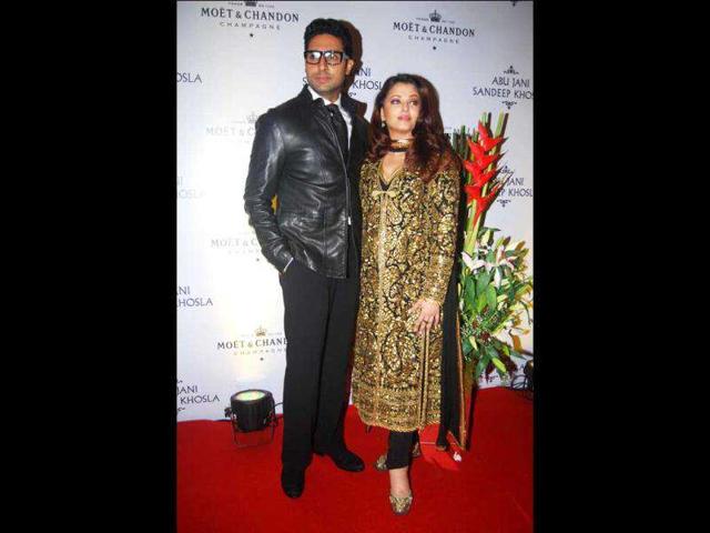 Abhishek can be seen in a black jacket over black pants.