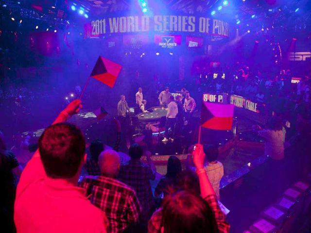 Fans cheer as the nine players arrive to compete in the final table of the World Series of Poker in Las Vegas. (AP Photo/Julie Jacobson) Fans cheer as the nine players arrive to compete in the final table of the World Series of Poker in Las Vegas. (AP Photo/Julie Jacobson)