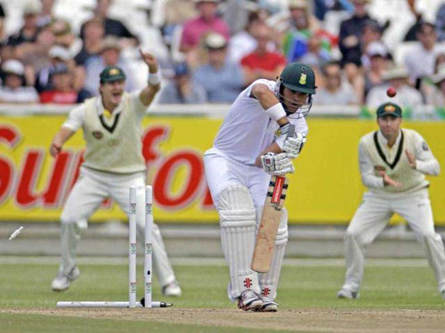 South Africa's Jacques Rudolph, center, looses his wicket during a test match against Australia in Cape Town, South Africa.
