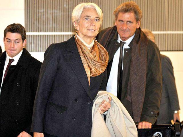 International Monetary Fund (IMF) Managing Director Christine Lagarde (C) arrives at Tokyo's Haneda Airport from Beijing. AFP