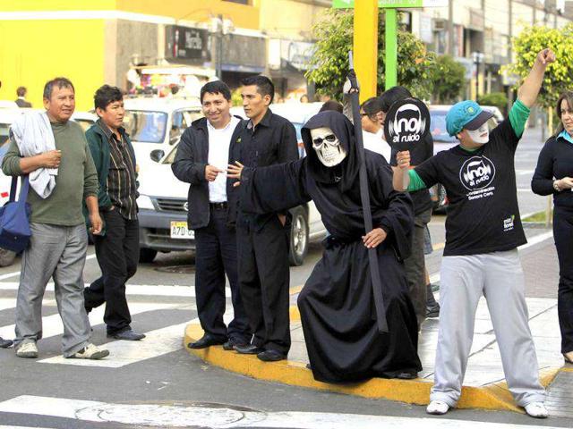 A man dressed as "Death" takes part in a campaign to encourage the use road crossings and discourage noise pollution in Lima's district of Miraflores. Reuters