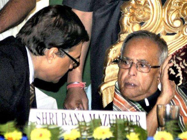 Union finance minister Pranab Mukherjee interacts with chairman AK Mukhopadhyay during inauguration function of 557th branch opening of Bangiya Gramin Vikash Bank at Krishnapore village in Murshidabad district.