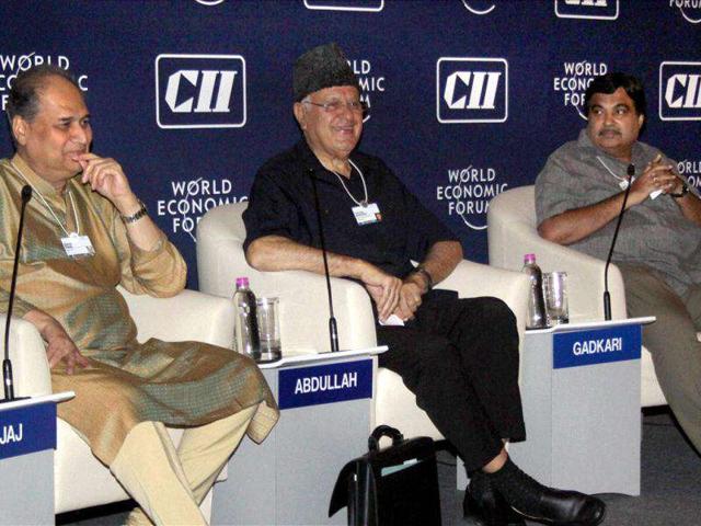 Rahul Bajaj, chairman of Bajaj Auto, Farooq Abdullah, minister for New and Renwable Energy and BJP President, Nitin Gadkari during the India Economic Summit in Mumbai.